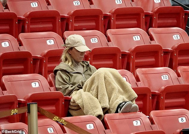 Mellencamp sat alone to watch her daughter Slate compete