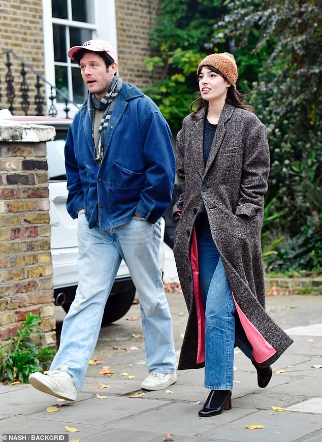 The stunning British model wore a long grey coat as she walked alongside her new partner