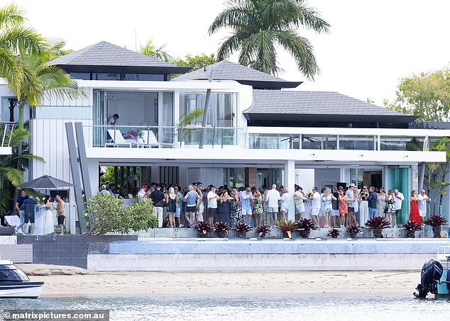 Guests gathered on the balcony of the stunning property as the celebrations began