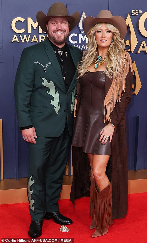 She was joined by husband Mitchell Tenpenny, 35, who sported a dark green suit as well as a bolo tie and a cowboy hat
