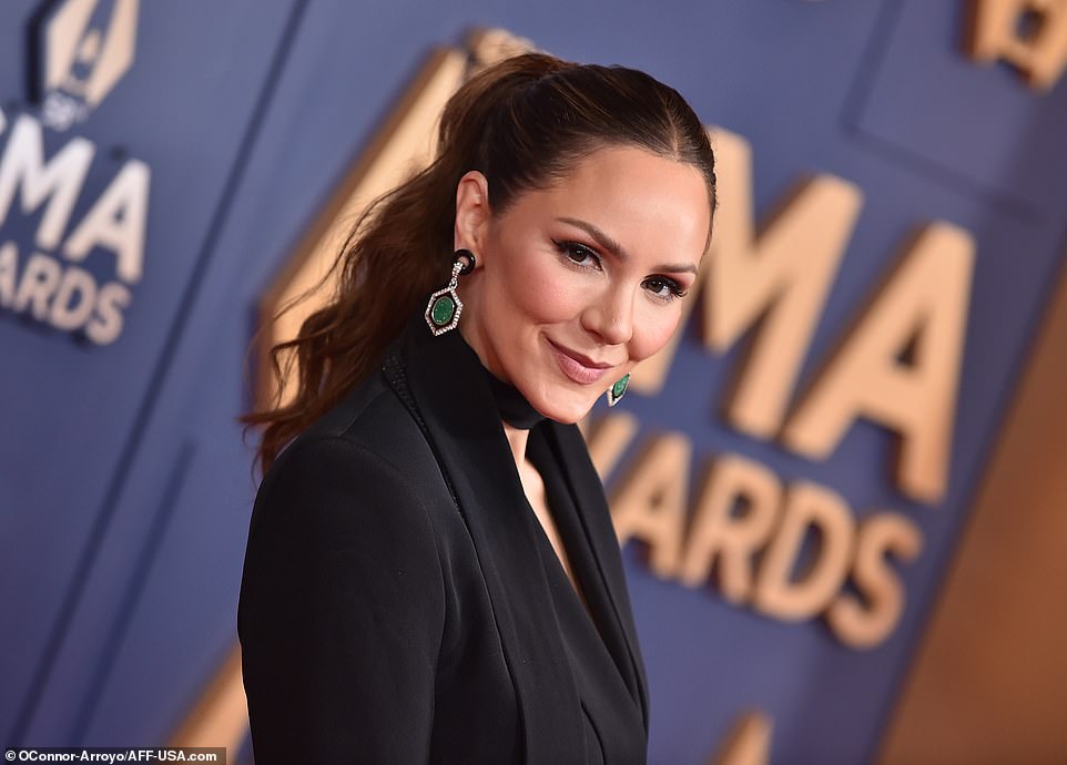 She accessorized with green earrings