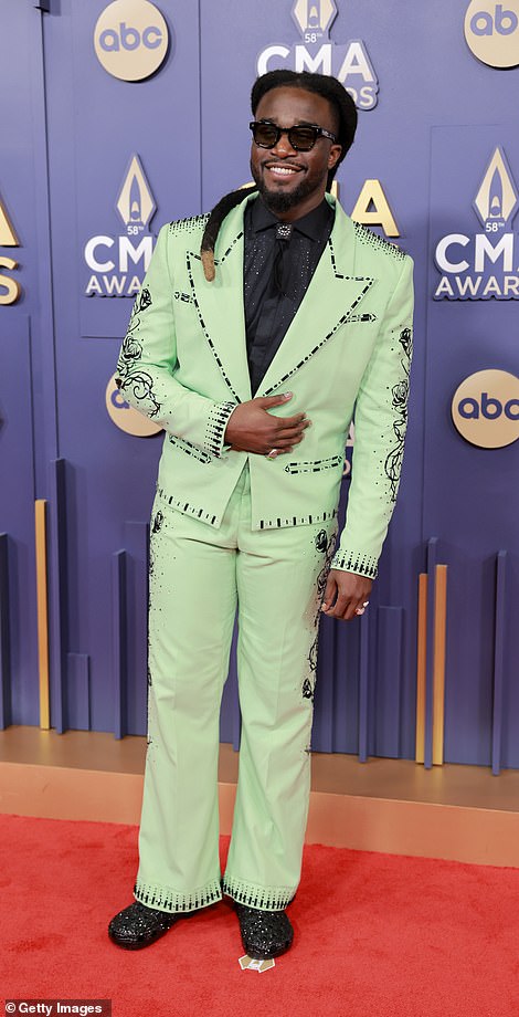 Shaboozey, 29, showed off his trendy style in a unique mint green suit