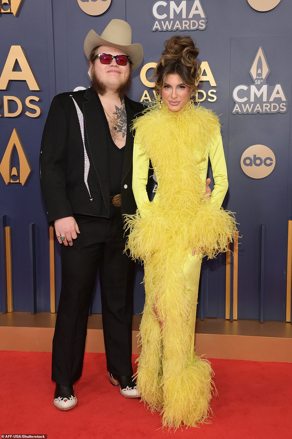 Marcus King, 28, was joined by wife Briley who made a dramatic entrance on the red carpet in a feather yellow gown