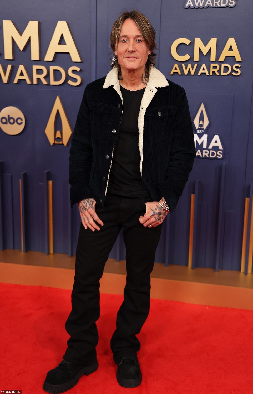 Keith Urban, 57, sported a laid-back look, wearing a sherpa collar jacket with a black t-shirt and jeans