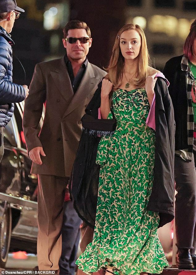 Phoebe transformed into the glamorous siren in her gorgeous green printed gown, and layered a jacket over her outfit to battle the chill