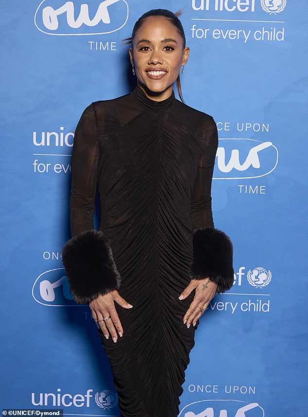 The cuffs the sleeves were covered with fuzzy material and she also opted for a pair of closed-toed, black heels
