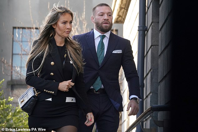 Conor McGregor and partner Dee Devlin outside the High Court in Dublin
