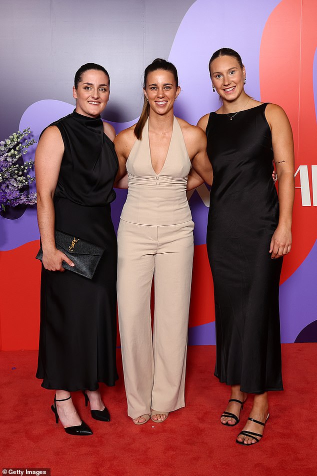 The Sydney Swans players Lucy McEvoy, Chloe Molloy and Montana Ham also all cuddled up for their red carpet moment