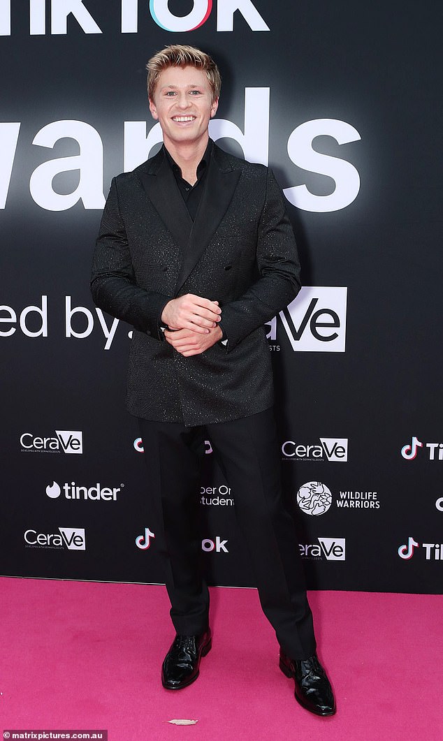 He also wore a pair of plain black pants and a pair of black leather shoes that were polished to perfection for the occasion