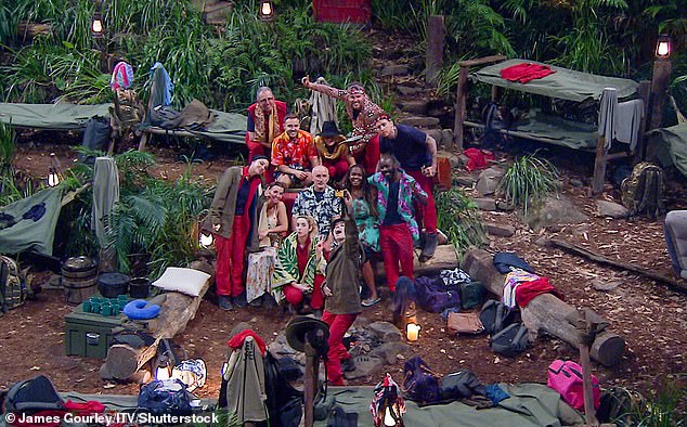 Gathering around the campfire in their mismatched clothes, Jane joked, 'this will be the worst wedding photo ever' as the stars posed waiting for Love Island star Maura to snap a picture