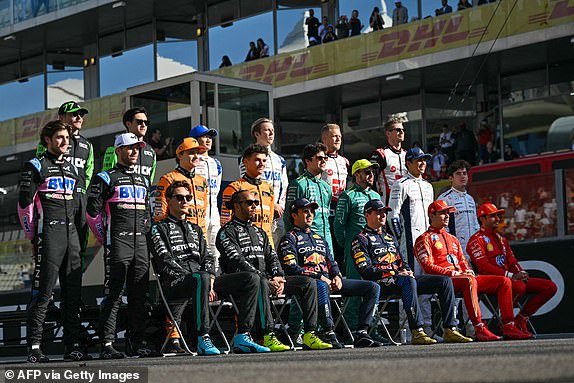 Drivers pose for a group photo ahead of the Abu Dhabi Formula One Grand Prix at the Yas Marina Circuit in Abu Dhabi on December 8, 2024. (Photo by Andrej ISAKOVIC / AFP) (Photo by ANDREJ ISAKOVIC/AFP via Getty Images)