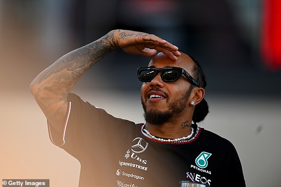 ABU DHABI, UNITED ARAB EMIRATES - DECEMBER 08: Lewis Hamilton of Great Britain and Mercedes looks on from the drivers parade prior to the F1 Grand Prix of Abu Dhabi at Yas Marina Circuit on December 08, 2024 in Abu Dhabi, United Arab Emirates. (Photo by Rudy Carezzevoli/Getty Images)