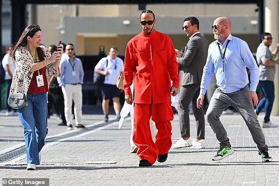ABU DHABI, UNITED ARAB EMIRATES - DECEMBER 08: Lewis Hamilton of Great Britain and Mercedes walks in the Paddock prior to the F1 Grand Prix of Abu Dhabi at Yas Marina Circuit on December 08, 2024 in Abu Dhabi, United Arab Emirates. (Photo by Clive Mason/Getty Images)