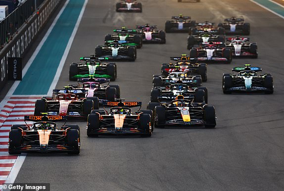 ABU DHABI, UNITED ARAB EMIRATES - DECEMBER 08: Lando Norris of Great Britain driving the (4) McLaren MCL38 Mercedes leads the field into turn one at the start during the F1 Grand Prix of Abu Dhabi at Yas Marina Circuit on December 08, 2024 in Abu Dhabi, United Arab Emirates. (Photo by Mark Thompson/Getty Images)