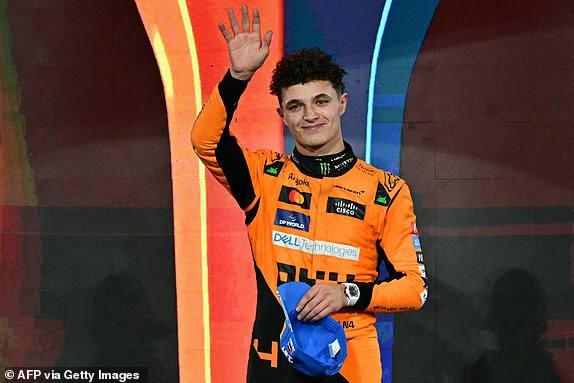 McLaren's British driver Lando Norris celebrates on the podium after winning the Abu Dhabi Formula One Grand Prix at the Yas Marina Circuit in Abu Dhabi on December 8, 2024. (Photo by Giuseppe CACACE / AFP) (Photo by GIUSEPPE CACACE/AFP via Getty Images)
