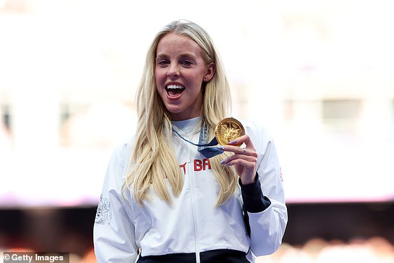 PARIS, FRANCE - AUGUST 06: Gold medalist Keely Hodgkinson of Team Great Britain (C) celebrates on the podium during the Women's 800m medal ceremony on day eleven of the Olympic Games Paris 2024 at Stade de France on August 06, 2024 in Paris, France. (Photo by Michael Steele/Getty Images)