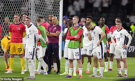 BERLIN, GERMANY - JULY 14: England players disappointed at the award ceremony (LR) Goalkeeper Dean Henderson of England Cole Palmer of England Adam Wharton of England Luke Shaw of England and Phil Foden of England after the UEFA EURO 2024 final match between Spain and England at Olympiastadion on July 14, 2024 in Berlin, Germany. (Photo by JÃ¼rgen Fromme - firo sportphoto/Getty Images)