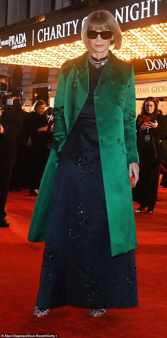 Vogue's Anna looked effortlessly stylish in a navy bejewelled gown and satin emerald overcoat