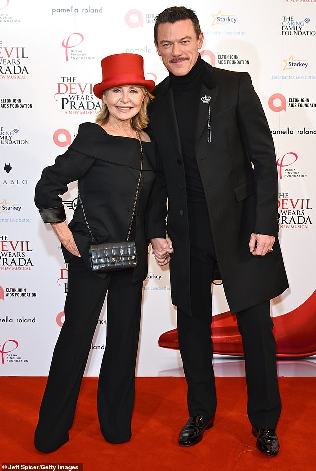 She posed alongside Hollywood hunk Luke Evans, 45