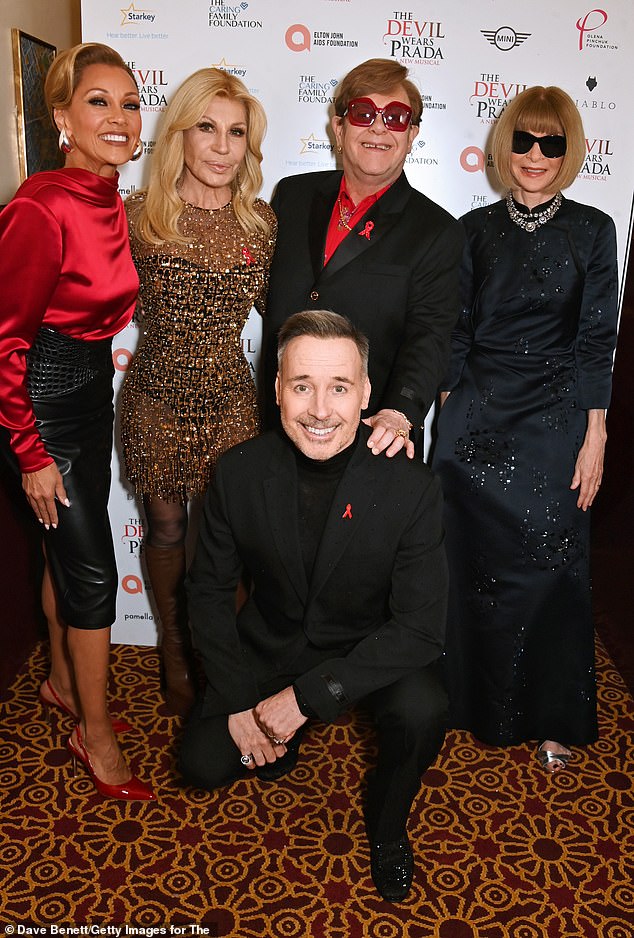 Elton was supported on his big night by famous friends Donatella Versace (L) and Anna Wintour (R) who joined him for snaps alongside show star Vanessa Williams (far left)