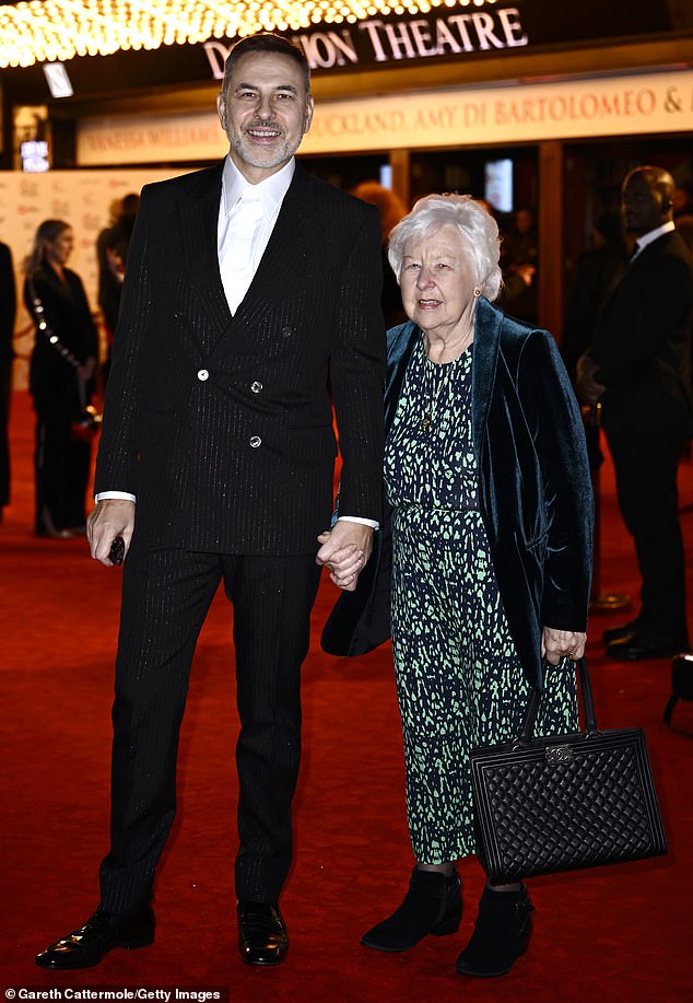 Little Britain star David was dressed to impress in a sparkly pin-strip suit