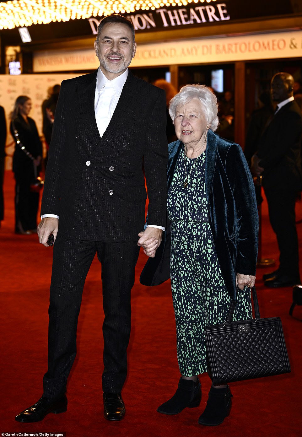 Little Britain star David was dressed to impress in a sparkly pin-strip suit