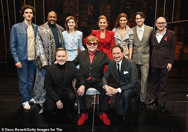 Sir Elton (centre) later posed with the cast following the show