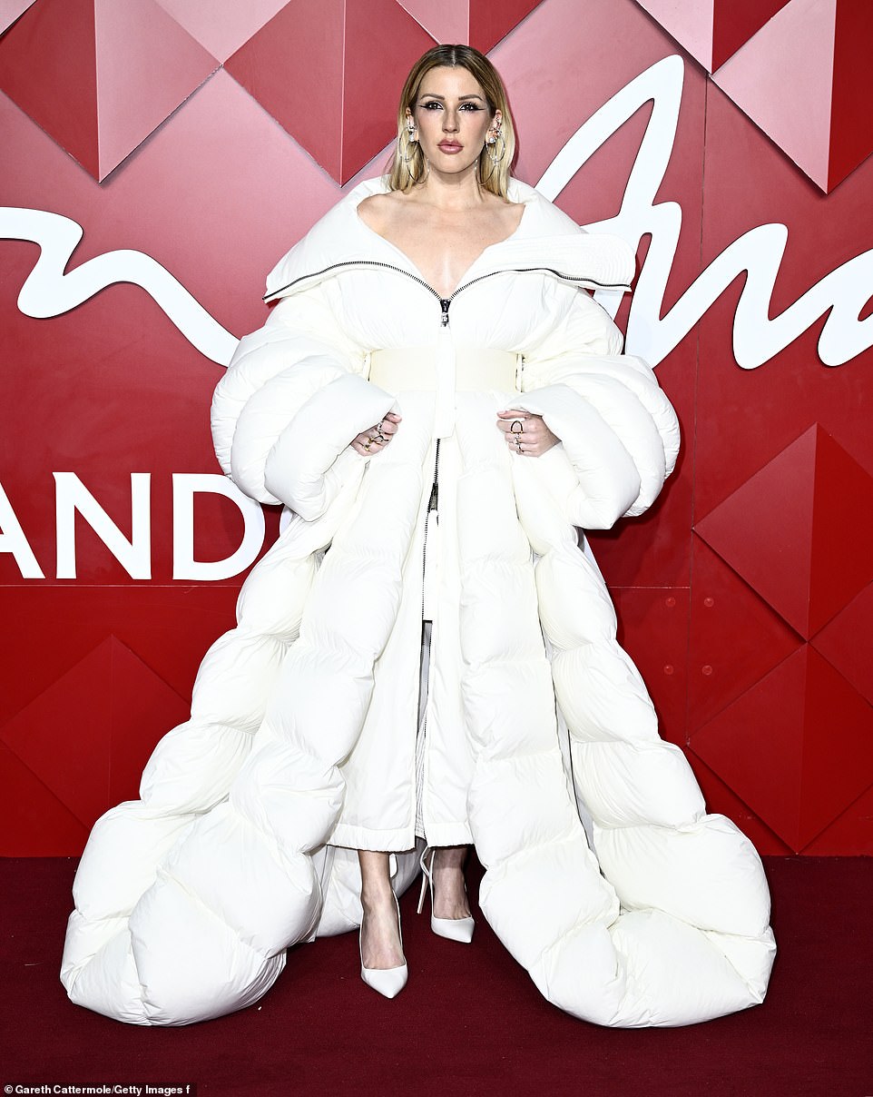 Ellie Goulding stepped away from her usual style and donned a huge padded white coat which flowed to the floor for her moment in the spotlight