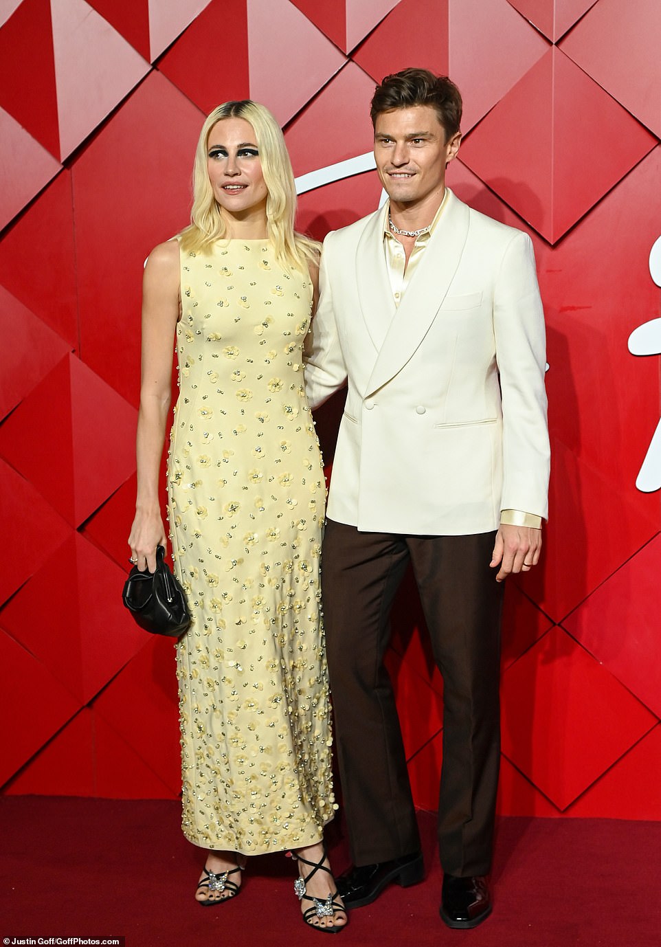 The singer was joined by her husband Oliver Cheshire who looked stylish in a white blazer and silk shirt