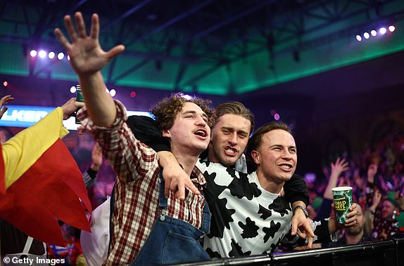 LONDON, ENGLAND - DECEMBER 29: Fans enjoy the match atmosphere during the third round match between Callan Rydz of Englandn and Dimitri Van den Bergh of Belgium on day twelve of the 2024/25 Paddy Power World Darts Championship at Alexandra Palace on December 29, 2024 in London, England.  (Photo by James Fearn/Getty Images)