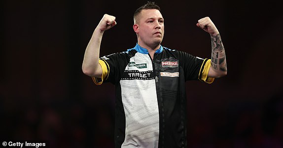 LONDON, ENGLAND - DECEMBER 30: Chris Dobey of England celebrates victory over Kevin Doets of the Netherlands following their fourth round match on day thirteen of the 2024/25 Paddy Power World Darts Championship at Alexandra Palace on December 30, 2024 in London, England.  (Photo by James Fearn/Getty Images)