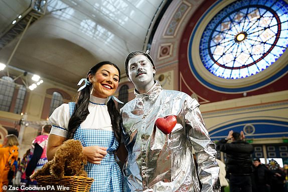 Fans dressed up as characters from "The Wizard of Oz" during day fourteen of the Paddy Power World Darts Championship at Alexandra Palace, London. Picture date: Wednesday January 1, 2025. PA Photo. See PA story DARTS World. Photo credit should read: Zac Goodwin/PA Wire.RESTRICTIONS: Use subject to restrictions. Editorial use only, no commercial use without prior consent from rights holder.