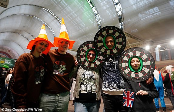 Fans in fancy dress during day fourteen of the Paddy Power World Darts Championship at Alexandra Palace, London. Picture date: Wednesday January 1, 2025. PA Photo. See PA story DARTS World. Photo credit should read: Zac Goodwin/PA Wire.RESTRICTIONS: Use subject to restrictions. Editorial use only, no commercial use without prior consent from rights holder.