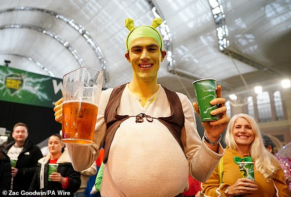 A Fan dressed up as "Shrek" during day fourteen of the Paddy Power World Darts Championship at Alexandra Palace, London. Picture date: Wednesday January 1, 2025. PA Photo. See PA story DARTS World. Photo credit should read: Zac Goodwin/PA Wire.RESTRICTIONS: Use subject to restrictions. Editorial use only, no commercial use without prior consent from rights holder.