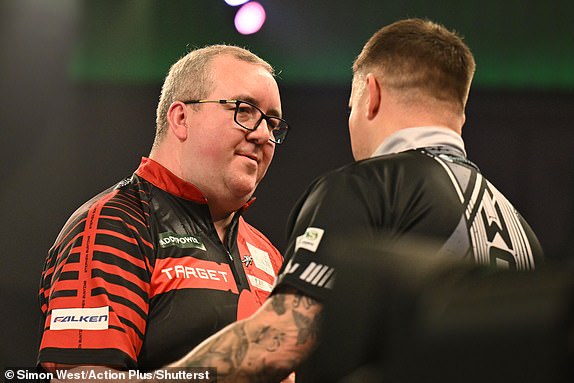 Mandatory Credit: Photo by Simon West/Action Plus/Shutterstock (15047245fj) Stephen Bunting wins his fourth round match with Luke Woodhouse and embraces his opponent; 30th December 2024, Alexandra Palace, London, England; 2024/25 PDC Paddy Power World Darts Championships Day 13. PDC World Darts Championship, Day 13, London, UK - 30 Dec 2024