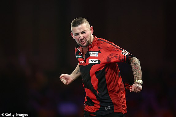 LONDON, ENGLAND - DECEMBER 30: Nathan Aspinall of England reacts against Ricardo Pietreczko of Germany during their fourth round match on day thirteen of the 2024/25 Paddy Power World Darts Championship at Alexandra Palace on December 30, 2024 in London, England.  (Photo by James Fearn/Getty Images)