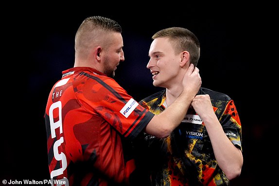 Ricardo Pietreczko (right) congratulates Nathan Aspinall on his victory during day thirteen of the Paddy Power World Darts Championship at Alexandra Palace, London. Picture date: Monday December 30, 2024. PA Photo. See PA story DARTS World. Photo credit should read: John Walton/PA Wire.RESTRICTIONS: Use subject to restrictions. Editorial use only, no commercial use without prior consent from rights holder.