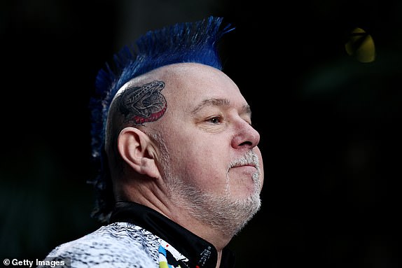 LONDON, ENGLAND - JANUARY 01: Peter Wright of Scotland looks on after speaking to the media prior to his Quarter-Final match against Stephen Bunting of England (not pictured) on Day Fourteen of the 2024/25 Paddy Power World Darts Championship at Alexandra Palace on January 01, 2025 in London, England.  (Photo by James Fearn/Getty Images)