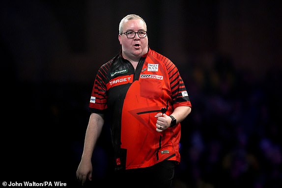 Stephen Bunting reacts during his match against Luke Woodhosue during day thirteen of the Paddy Power World Darts Championship at Alexandra Palace, London. Picture date: Monday December 30, 2024. PA Photo. See PA story DARTS World. Photo credit should read: John Walton/PA Wire.RESTRICTIONS: Use subject to restrictions. Editorial use only, no commercial use without prior consent from rights holder.
