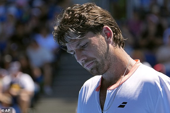 Cameron Norrie of Britain reacts during his first round loss to Matteo Berrettini of Italy at the Australian Open tennis championship in Melbourne, Australia, Tuesday, Jan. 14, 2025. (AP Photo/Asanka Brendon Ratnayake)