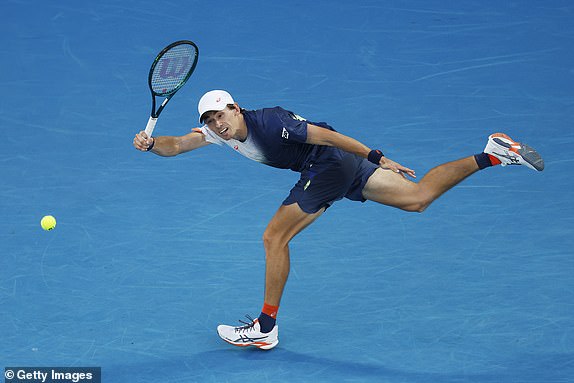 MELBOURNE, AUSTRALIA - JANUARY 14: Alex de Minaur of Australia plays a forehand against Botic van de Zandschulp of the Netherlands in the Men's Singles First Round match during day three of the 2025 Australian Open at Melbourne Park on January 14, 2025 in Melbourne, Australia. (Photo by Daniel Pockett/Getty Images)