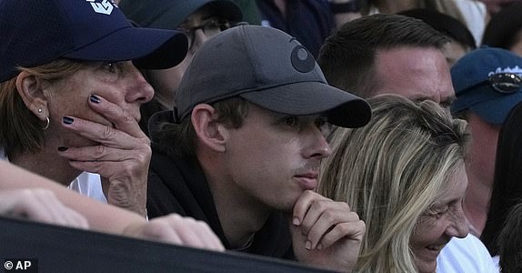 Alex de Minaur of Australia watches the second round match between Katie Boulter of Britain and Veronika Kudermetova of Russia at the Australian Open tennis championship in Melbourne, Australia, Thursday, Jan. 16, 2025. (AP Photo/Manish Swarup)