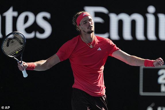 Alexander Zverev of Germany celebrates after defeating Tommy Paul of the U.S. in their quarterfinal match at the Australian Open tennis championship in Melbourne, Australia, Tuesday, Jan. 21, 2025. (AP Photo/Vincent Thian)