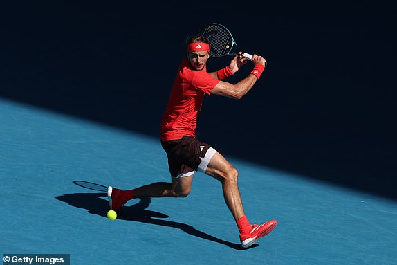 MELBOURNE, AUSTRALIA - JANUARY 21: Alexander Zverev of Germany plays a backhand against Tommy Paul of the United States in the Men's Singles Quarterfinal match during day 10 of the 2025 Australian Open at Melbourne Park on January 21, 2025 in Melbourne, Australia. (Photo by Clive Brunskill/Getty Images)