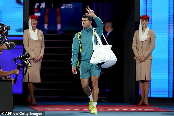 Spain's Carlos Alcaraz arrives to face Serbia's Novak Djokovic during their men's singles quaterfinal match on day ten of the Australian Open tennis tournament in Melbourne on January 21, 2025. (Photo by Martin KEEP / AFP) / -- IMAGE RESTRICTED TO EDITORIAL USE - STRICTLY NO COMMERCIAL USE -- (Photo by MARTIN KEEP/AFP via Getty Images)