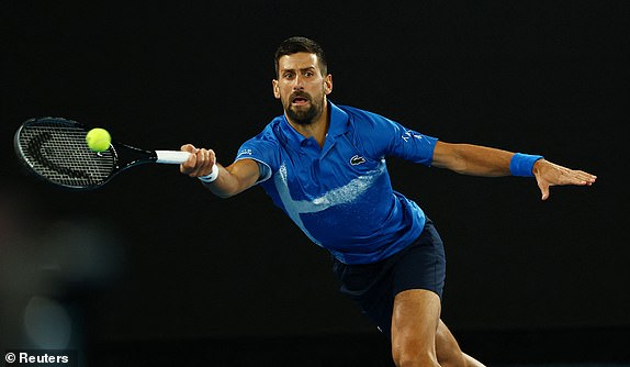 Tennis - Australian Open - Melbourne Park, Melbourne, Australia - January 21, 2025 Serbia's Novak Djokovic in action during his quarter final match against Spain's Carlos Alcaraz REUTERS/Edgar Su