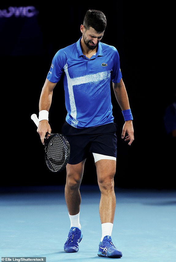 Mandatory Credit: Photo by Ella Ling/Shutterstock (15108779bh) Novak Djokovic winces with his leg bandaged after a medical timeout during his Quarter-final match against Alcaraz in the Rod Laver Arena Australian Open, Day Ten, Tennis, Melbourne Park, Melbourne, Australia - 21 Jan 2025