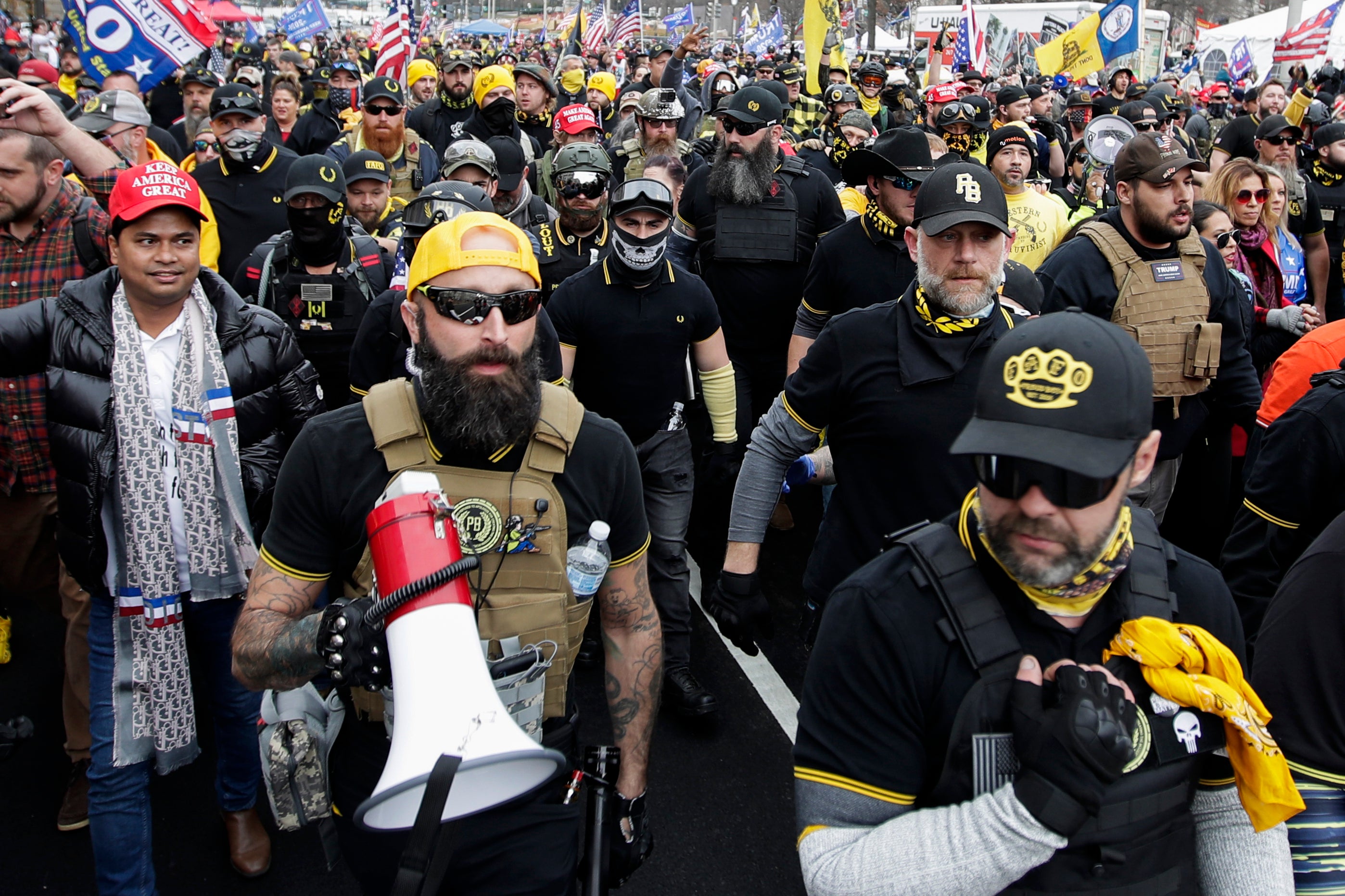 Jeremy Bertino, second from left, joins Proud Boys members at a rally at Freedom Plaza in Washington on December 12, 2020