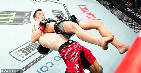 SYDNEY, AUSTRALIA - FEBRUARY 09: (L-R) Aleksandre Topuria of Germany suplexes Colby Thicknesse of Australia in a bantamweight fight during the UFC 312 event at Qudos Bank Arena on February 09, 2025 in Sydney, Australia.  (Photo by Jeff Bottari/Zuffa LLC)
