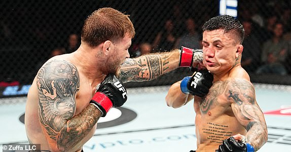 SYDNEY, AUSTRALIA - FEBRUARY 09: (L-R) Jake Matthews of Australia punches Francisco Prado of Argentina in a welterweight fight during the UFC 312 event at Qudos Bank Arena on February 09, 2025 in Sydney, Australia.  (Photo by Jeff Bottari/Zuffa LLC)